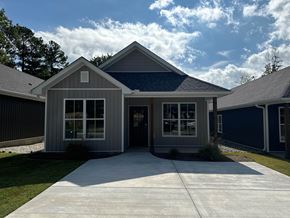 Little Rock house for rent - A house with a grey roof and a blue sky in the background.