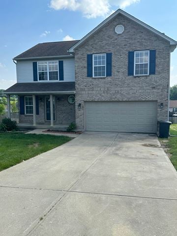 Walton house for rent - A two-story house with a garage and a driveway.