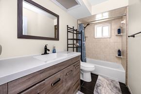 Largo house for rent - A bathroom with a white sink and a white toilet.