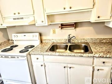 Panama City Beach house for rent - A kitchen with a white oven and sink.