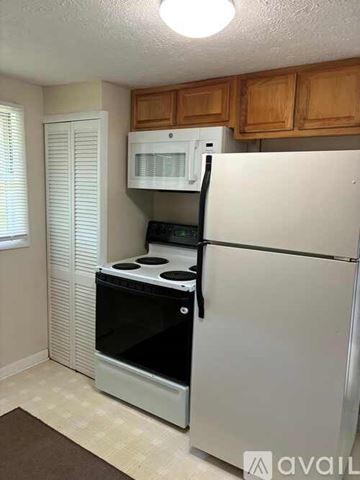 Candler apartment for rent - A white refrigerator with a black handle is in a kitchen.