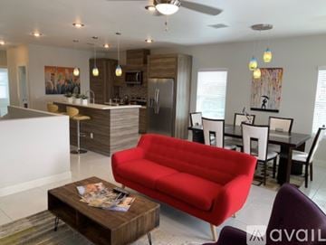 El Paso townhouse for rent - A red couch is in the middle of a modern living room.