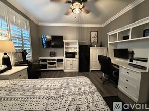 Stockton house for rent - A bedroom with a bed, nightstand, and a dresser.
