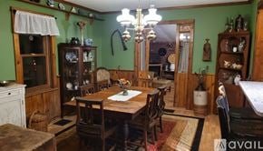 Rosendale house for rent - A dining room with a wooden table and chairs.