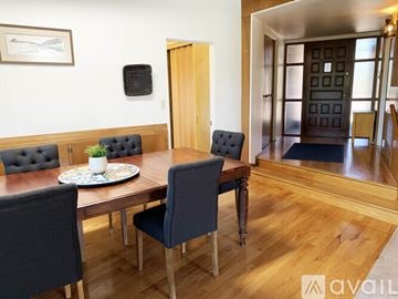Oro Valley house for rent - A dining room with a wooden table and chairs.