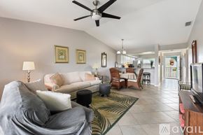 Punta Gorda condo for rent - A bedroom with a bed, nightstand, and television.