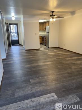 Salem apartment for rent - A spacious room with wooden flooring and a ceiling fan.