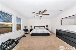 Fort Worth house for rent - A kitchen with a granite countertop and white chairs.