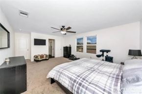 Fort Worth house for rent - A backyard with a covered grill and wooden fence.