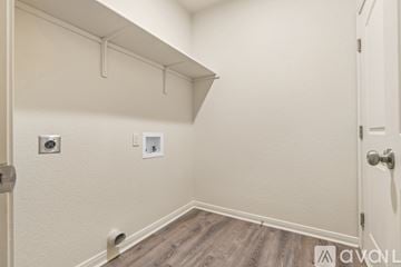 Hewitt apartment for rent - A kitchen area with a refrigerator, cabinets, and a countertop.