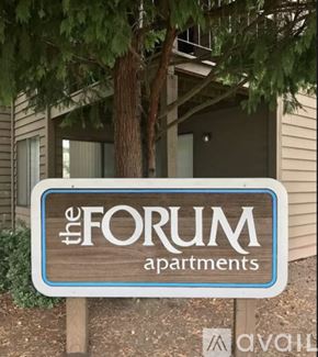 Salem apartment for rent - A sign for "The Forum Apartments" is displayed in front of a building.