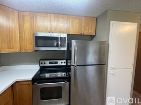 Lynnwood apartment for rent - A kitchen with a stove, oven, microwave, and refrigerator.