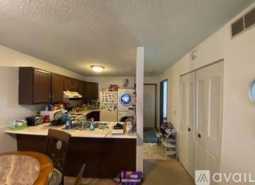 Mankato apartment for rent - A kitchen with a table and chairs in it.