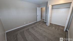 Saint Johns apartment for rent - A carpeted room with a doorway leading to another room.