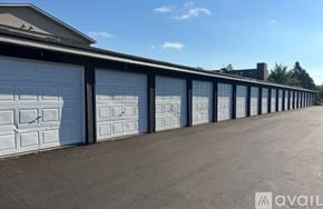 Big Lake apartment for rent - A kitchen with a stainless steel refrigerator, microwave, oven, and cabinets.