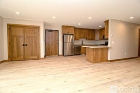 Big Lake apartment for rent - A kitchen with a marble countertop and a refrigerator.