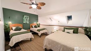 Little River condo for rent - A room with two beds and a ceiling fan.