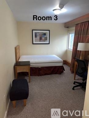 Ithaca house for rent - A dining room with a black table and chairs.
