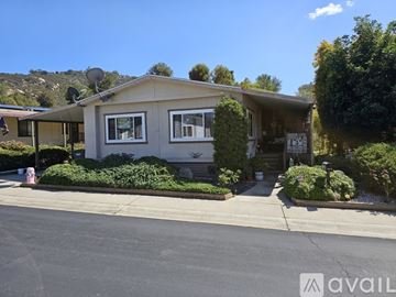 Escondido apartment for rent - A house with a front yard and a driveway.