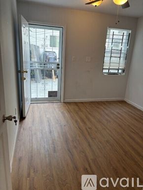 Philadelphia house for rent - A room with wooden flooring and a ceiling fan.