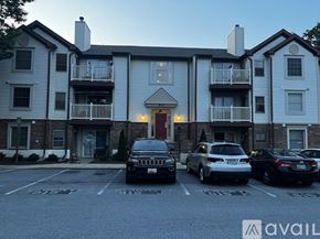 Frederick condo for rent - A room with a ceiling fan and a window.