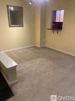Frederick condo for rent - A living room with a fireplace and sliding glass doors leading to a patio.