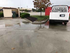 Olathe apartment for rent - A white van is parked in a parking lot.