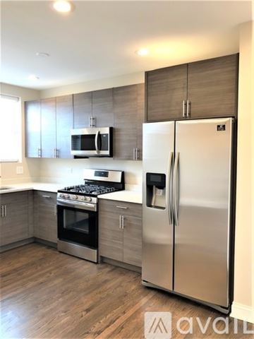 Chicago apartment for rent - A kitchen with a stainless steel refrigerator and oven.