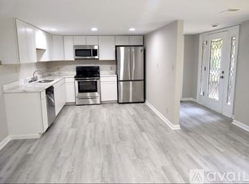 Ashland City apartment for rent - A kitchen with white cabinets and a grey floor.