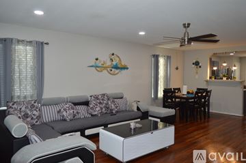 San Antonio house for rent - A living room with a grey couch and a coffee table.