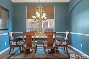 Austin house for rent - A dining room with a table and chairs.
