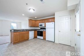 Millersville apartment for rent - A spacious empty room with a carpeted floor and white walls.