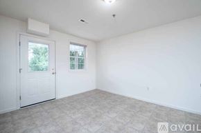 Millersville apartment for rent - A white room with a window and a carpeted floor.