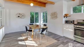 Portland apartment for rent - A dining area with a table and chairs is shown.