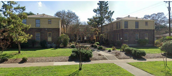 San Antonio apartment for rent - A grassy area with a walking path and two houses.
