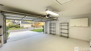 Ponte Vedra Beach house for rent - A spacious garage with a view of a residential area outside.