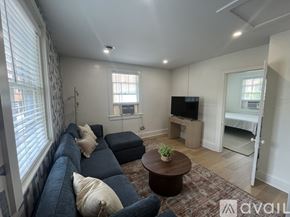 Charlottesville apartment for rent - A bedroom with a bed, desk, and chair.
