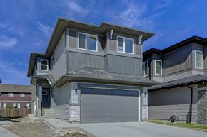 Spruce Grove apartment for rent - A modern house with a grey garage door.