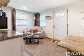 Hickory apartment for rent - A living room with a couch, a coffee table, and a television.
