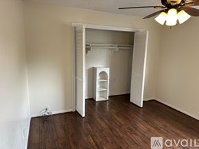 Houston house for rent - A white closet with a shelf and a door.