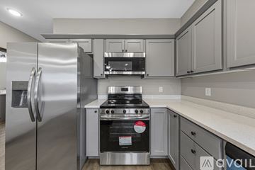 Saint Peter townhouse for rent - A modern kitchen with a stainless steel refrigerator and oven.