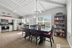 Richardson house for rent - A kitchen with a dining table and chairs.