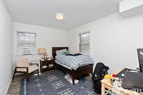 Charlottesville apartment for rent - A bedroom with a bed, chair, and desk.