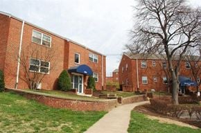 Falls Church apartment for rent - a sidewalk in front of a brick building