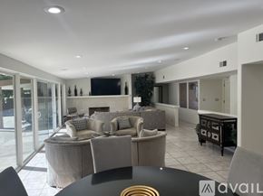 Indian Wells house for rent - A kitchen with wooden cabinets and a refrigerator.