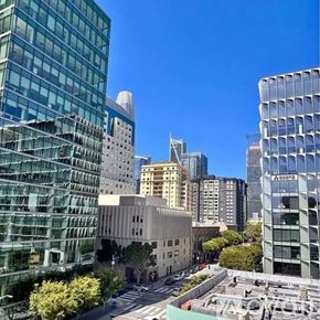 San Francisco apartment for rent - A cityscape with tall buildings and a clear blue sky.