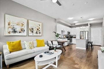Sarasota apartment for rent - A living room with a white couch and yellow pillows.