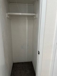 Deltona apartment for rent - A white door with a black handle is open to a small, empty room.