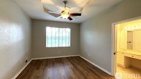 West Palm Beach house for rent - A living room with a flat screen TV and sliding glass doors.