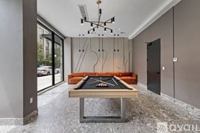 Brooklyn apartment for rent - A pool table in a room with a modern design.